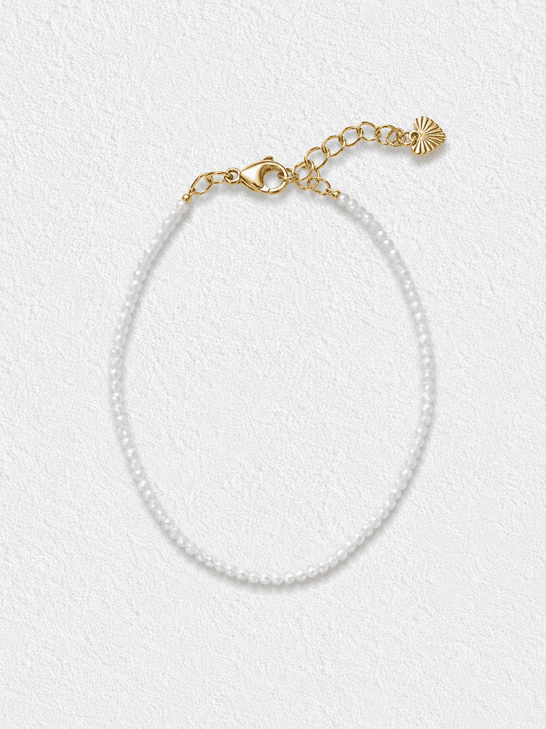 ESPUMA DE GÜIGÜÍ · Pulsera de Cristales blancos facetadas con cierre dorado