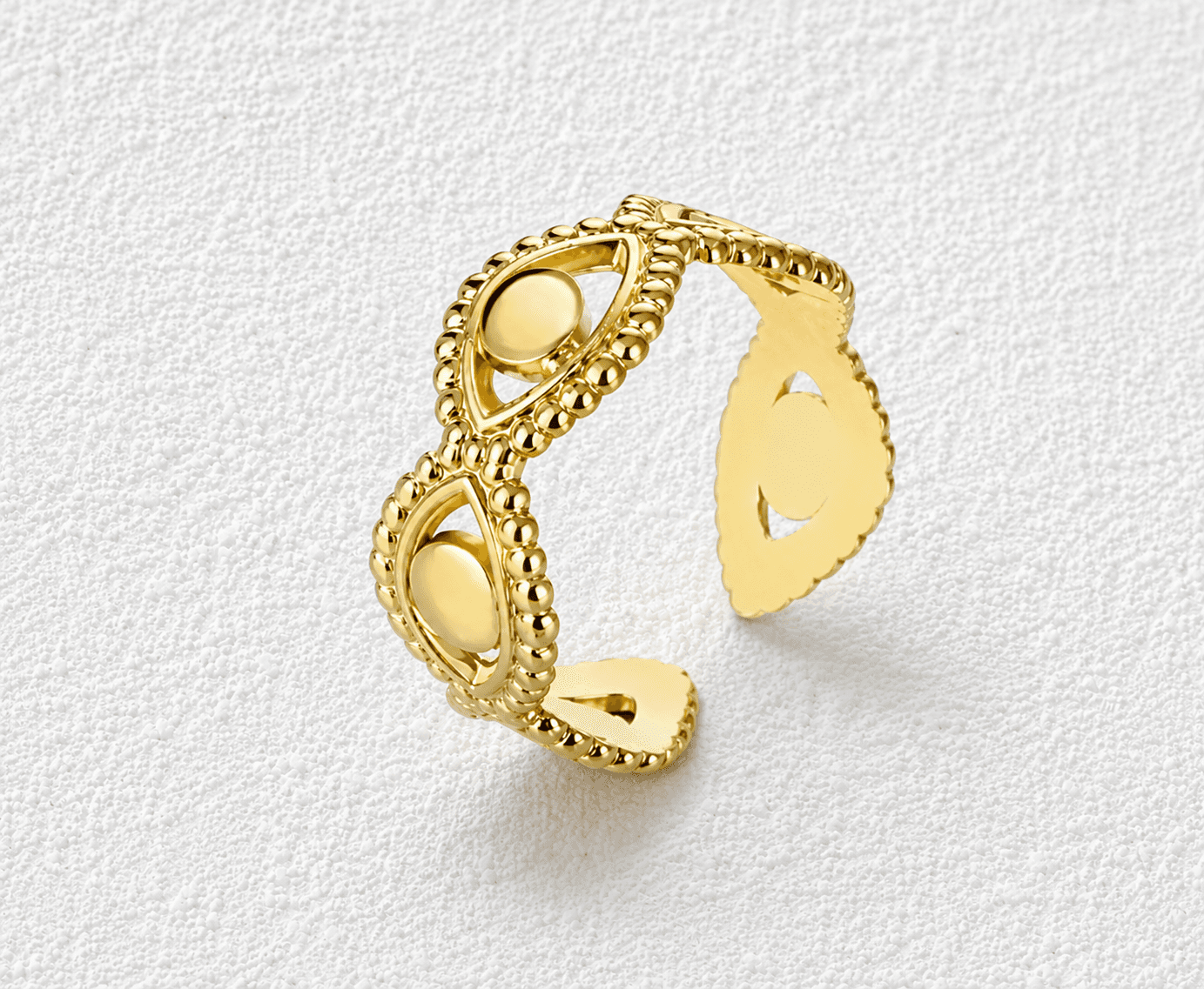 OJOS DE BENTAYGA · Anillo abierto calado en oro con motivos de ojos