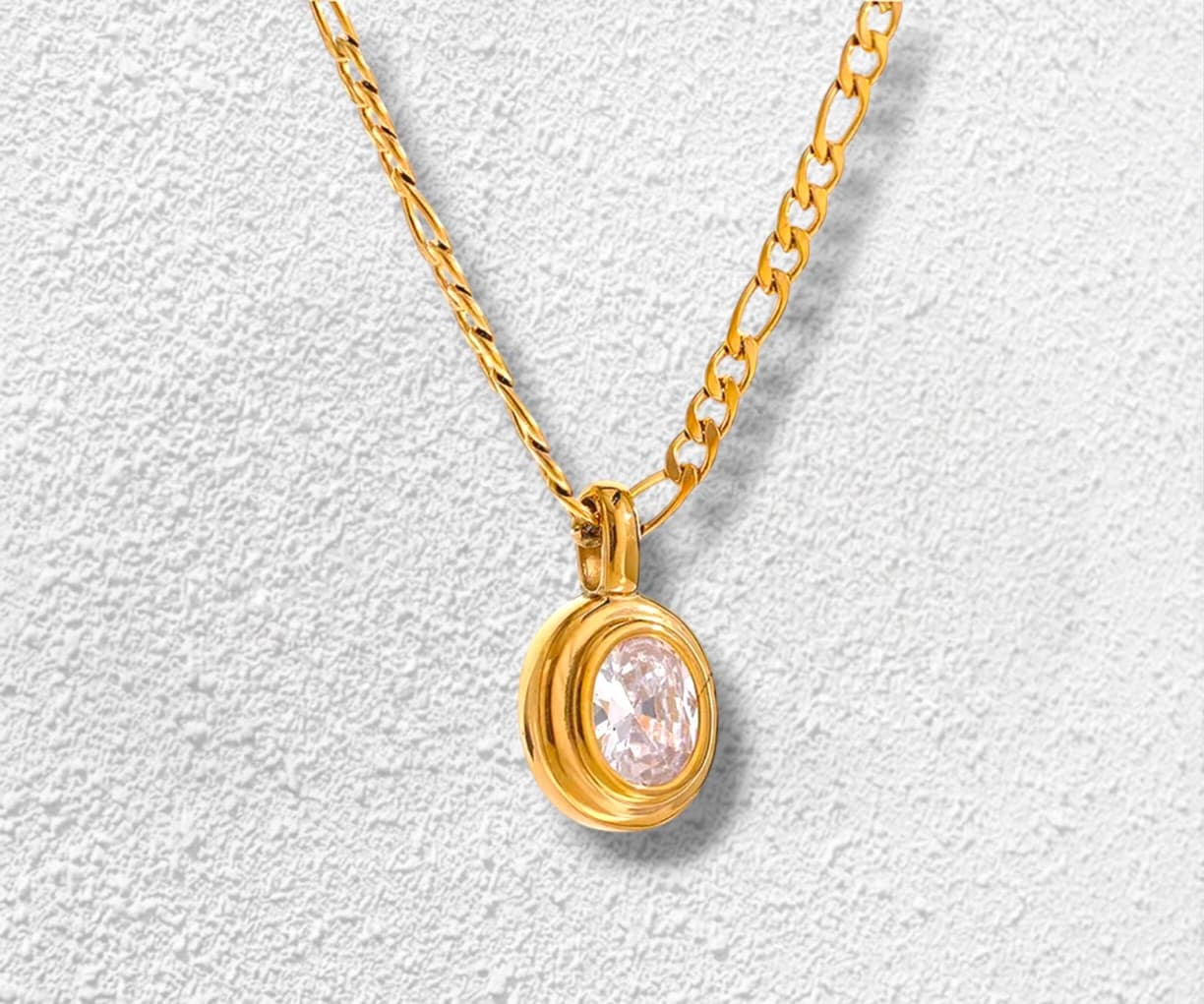 Centro del Mundo Collar · Cadena figaro · Circonita oval · Montura bezel