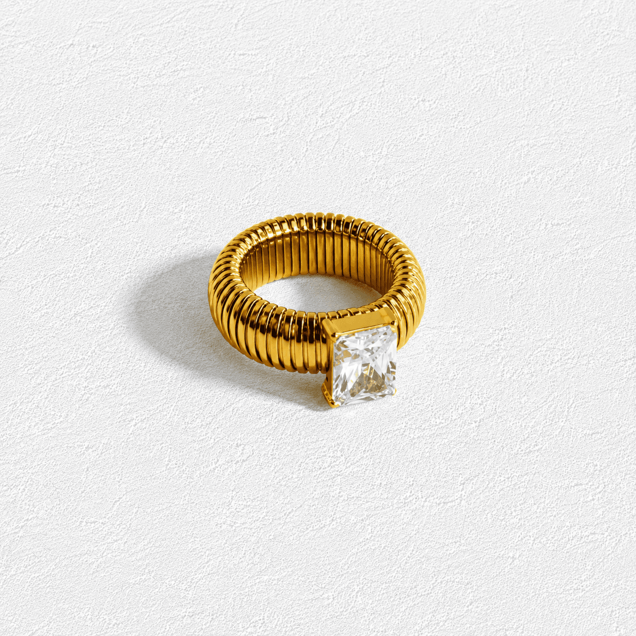 Columna de Sal Anillo · Circonita emerald cut · Banda acanalada