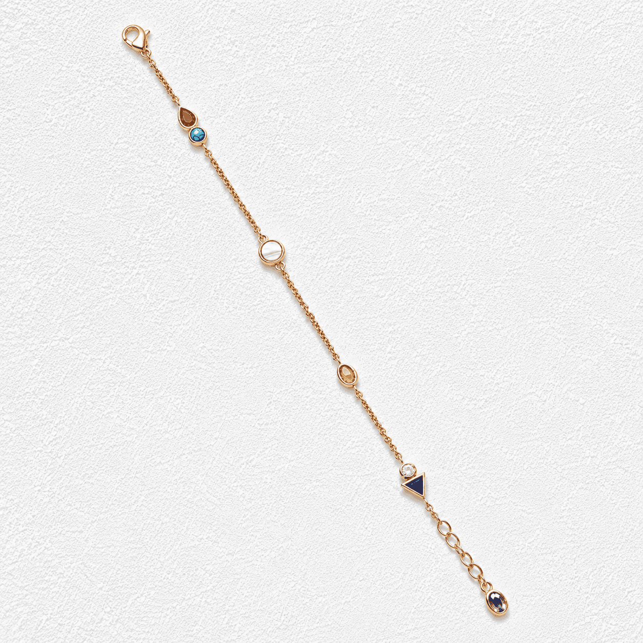 ARCHIPIÉLAGO · Pulsera de cadena fina con piedras multicolor en distintas formas engastadas