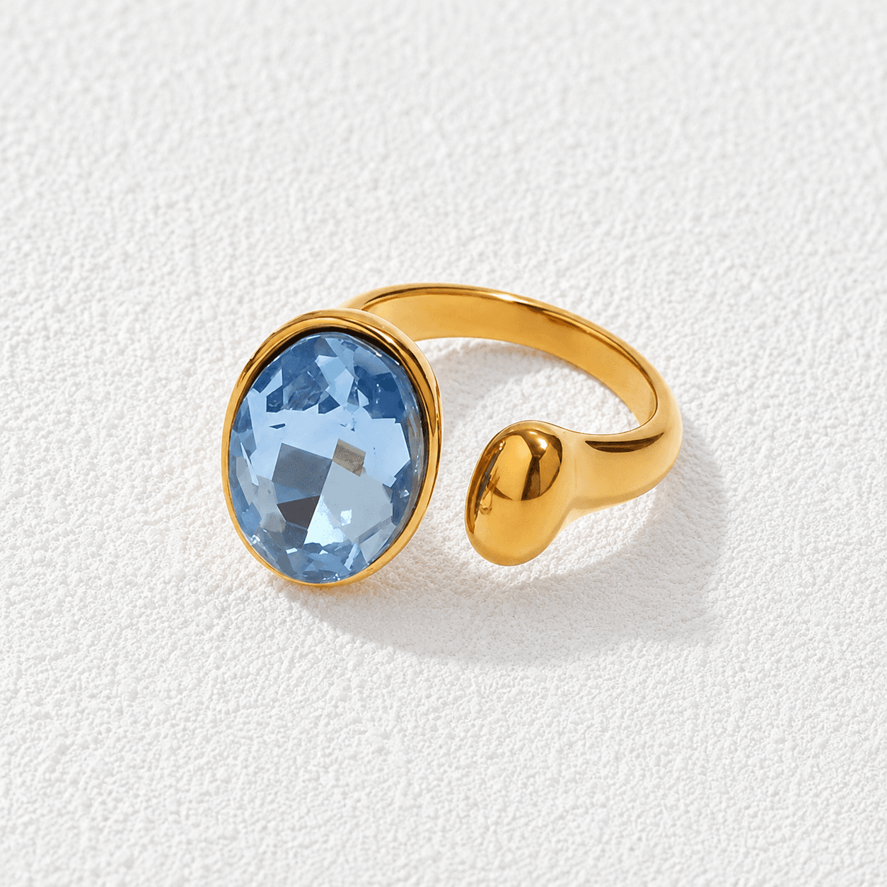 Caleta · Anillo piedra azul oval ajustable