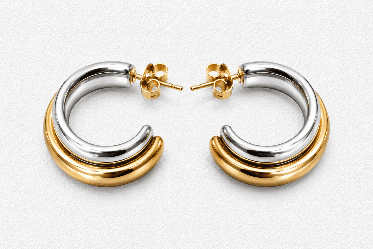 DOS METALES · Pendientes bicolor (plata y oro) en aro grueso