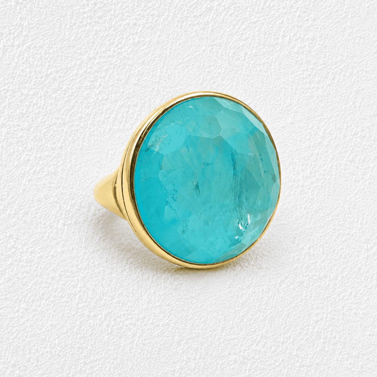 CHARCO AZUL · Anillo dorado, piedra turquesa grande facetada