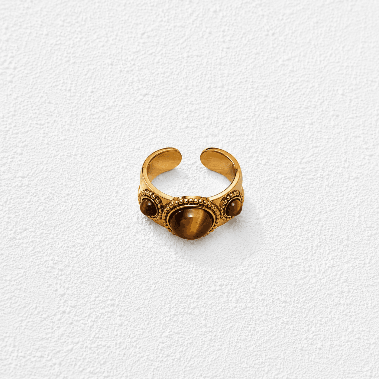 Tres Garras Anillo ajustable · Ojo de tigre triple · Banda texturizada